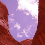 chasm of red rocks in Southern Utah; photo by Jay Brett Jenkins