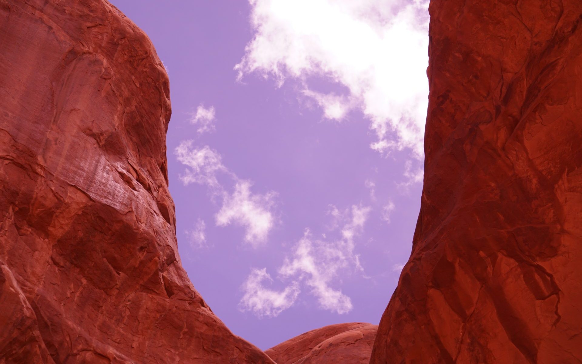 chasm of red rocks in Southern Utah; photo by Jay Brett Jenkins